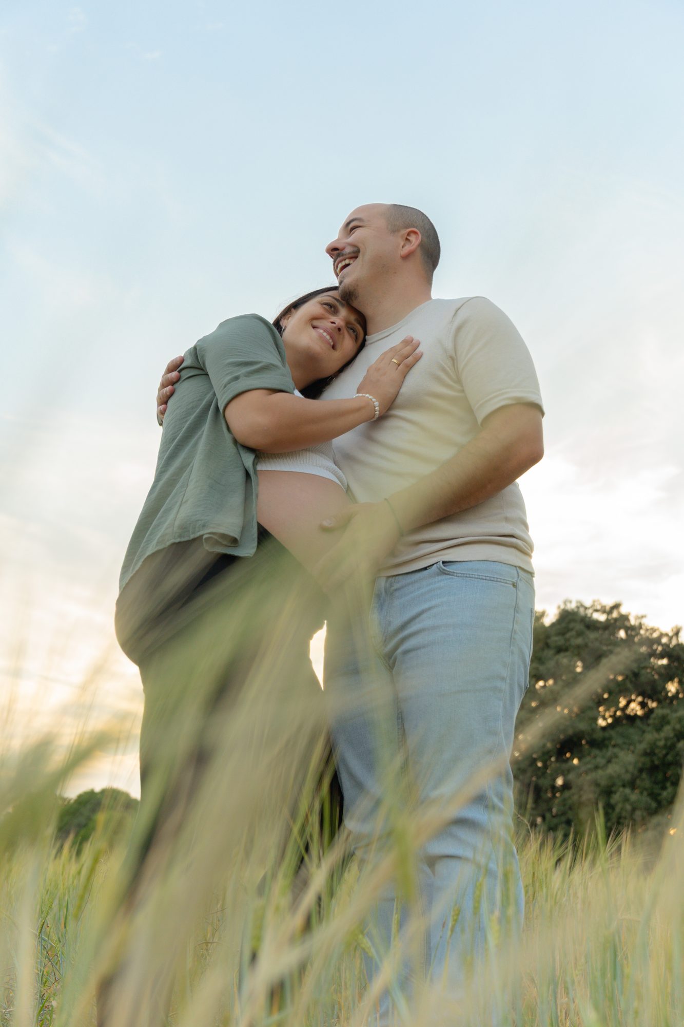 Expecting parents in a field — Revel Studio