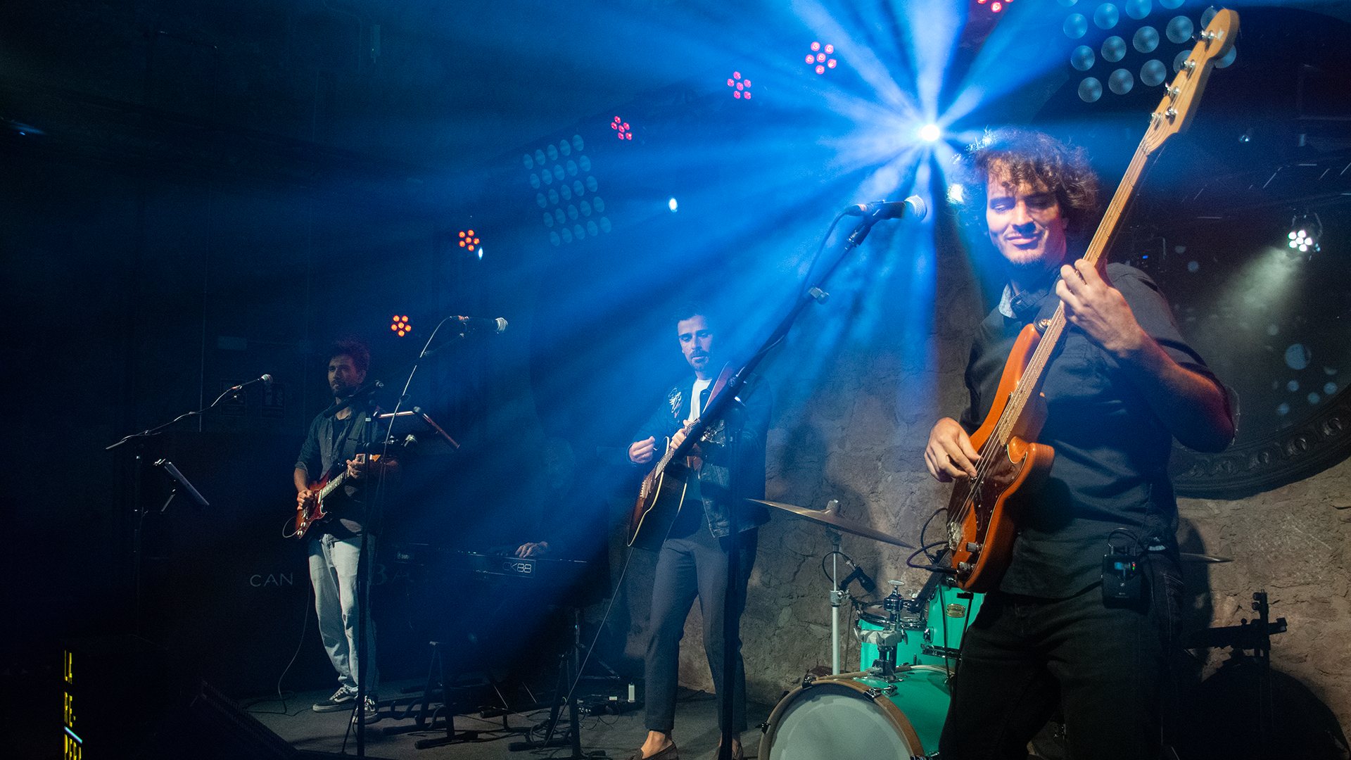 A live band on stage — Revel Studio
